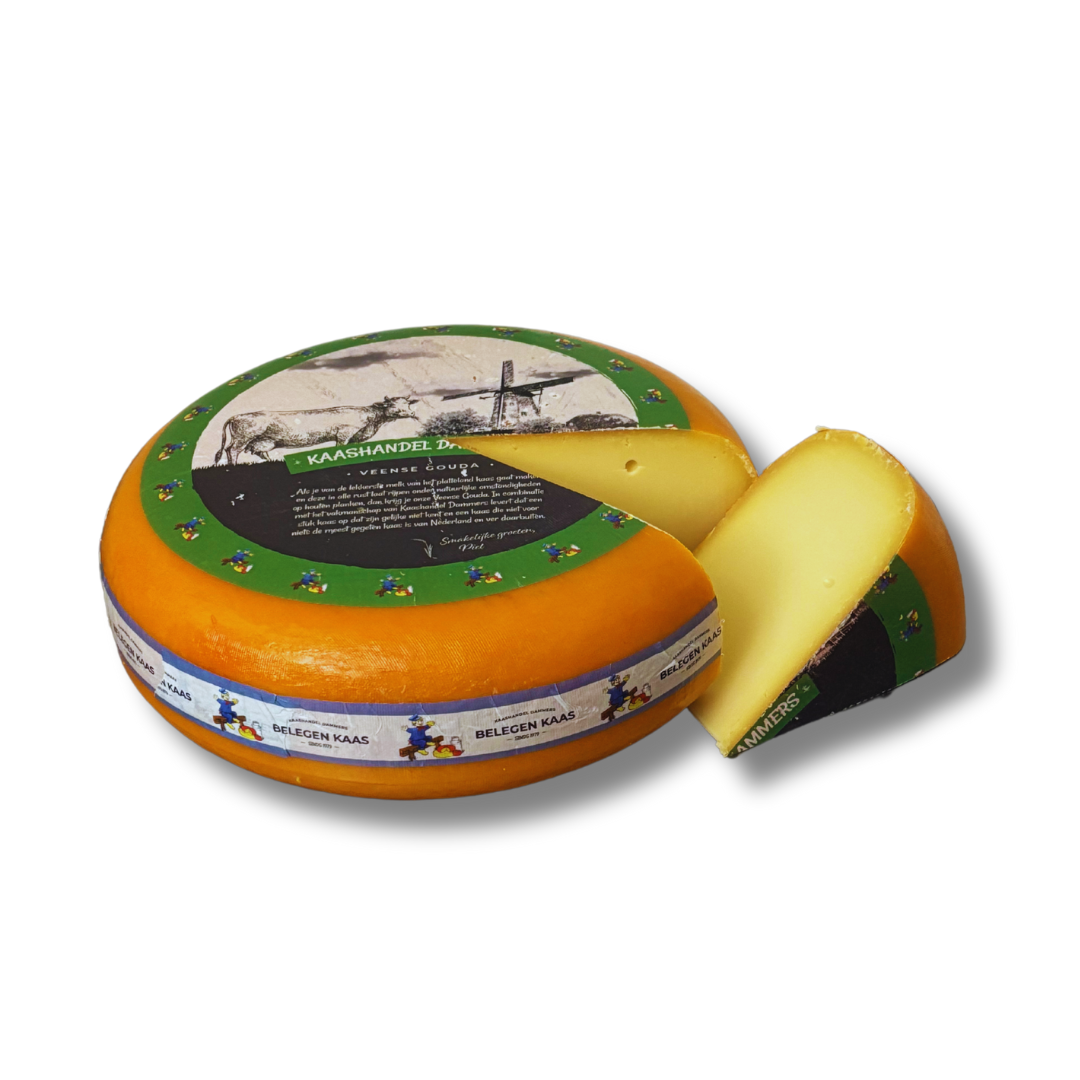 Round cheese with a slice removed, featuring a decorative label on a white background
