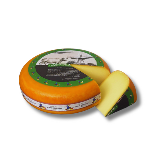 Round cheese with a slice removed, featuring a decorative label on a white background