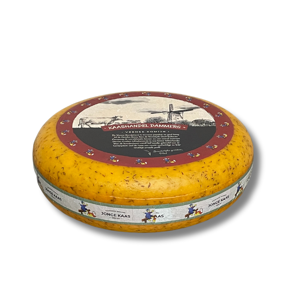 Round cheese wheel with decorative label on a white background