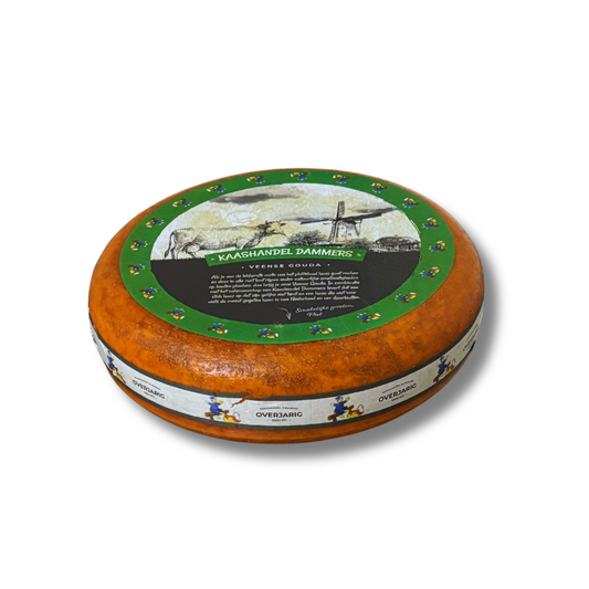Round cheese wheel with decorative label on a white background